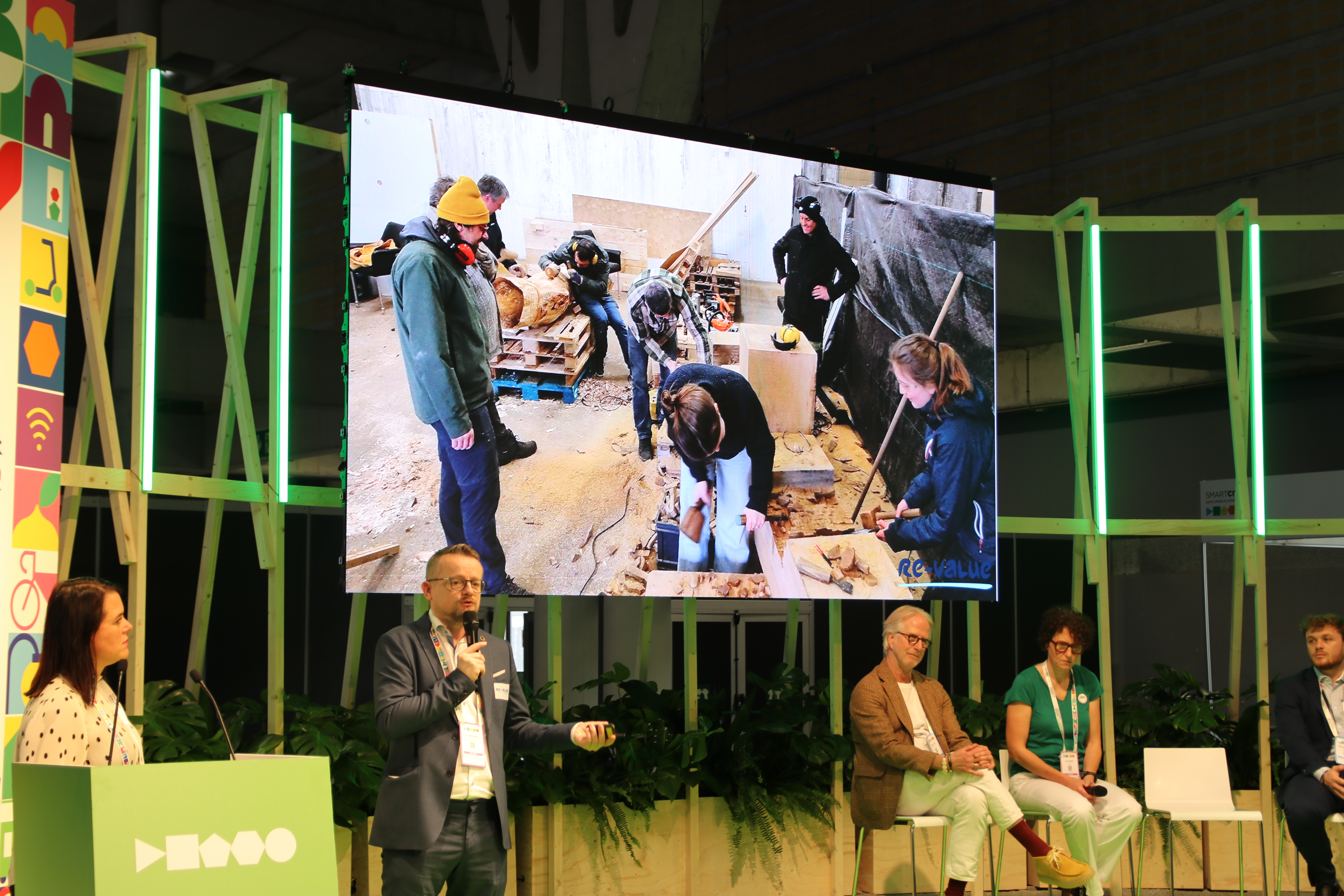A photo of Dirk Ahlers, a gentleman speaking on a stage