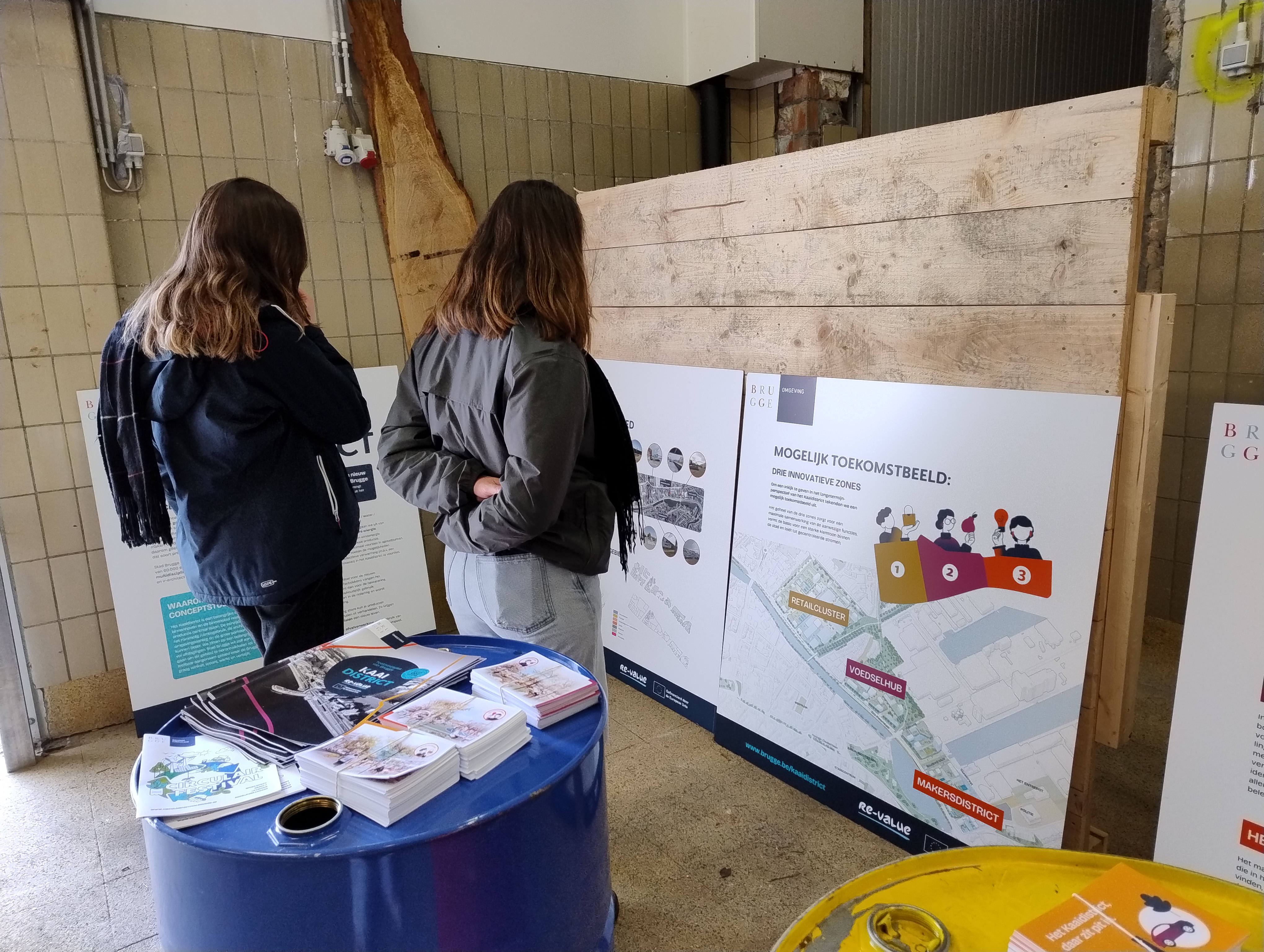 A group of people looking at a banner