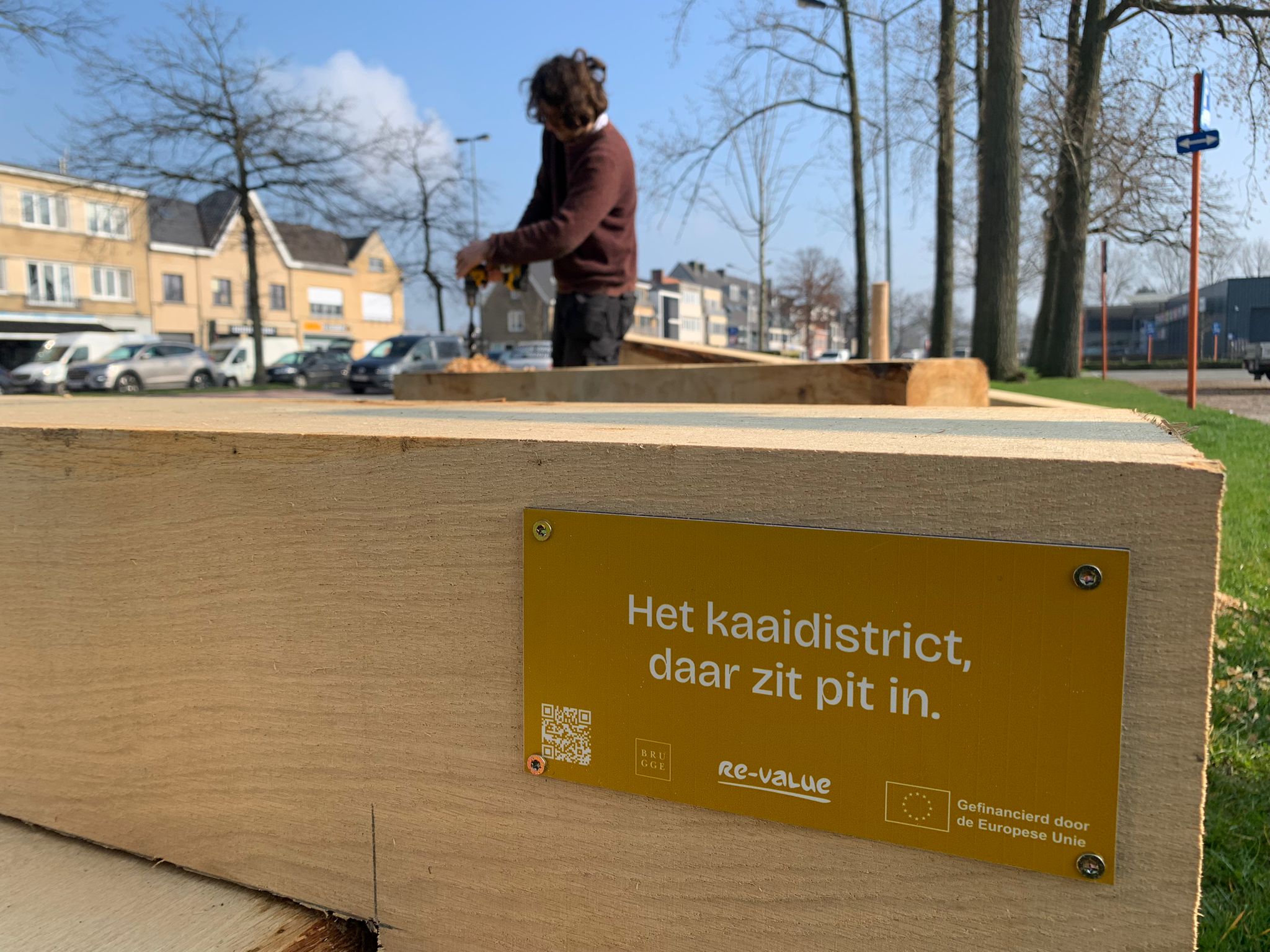 The new wood out in the open wiht a sign saying re-value and funded by the eu.