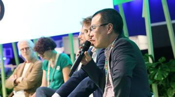 A group of people sitting on a stage