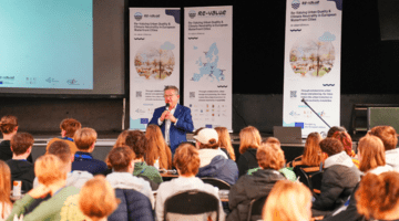 The Mayor of Bruges is speaking to a group of students