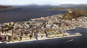 Interpretation of a possible future in Ålesund. The picture is a visualistion from above of how the Sørsida area might look in the future. It show the city of Ålesund and what appears to be a seriies of new buildings on the waterfront area.