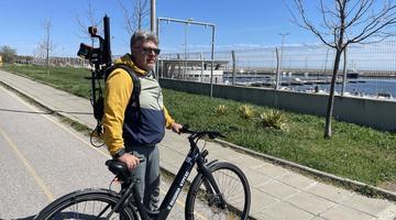 A man standing with an electric bike and a eoSLAM ZEB Horizon laser scanner A man standing with an electric bike and a eoSLAM ZEB Horizon laser scanner