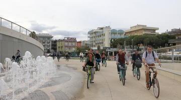 A small group of people biking. 