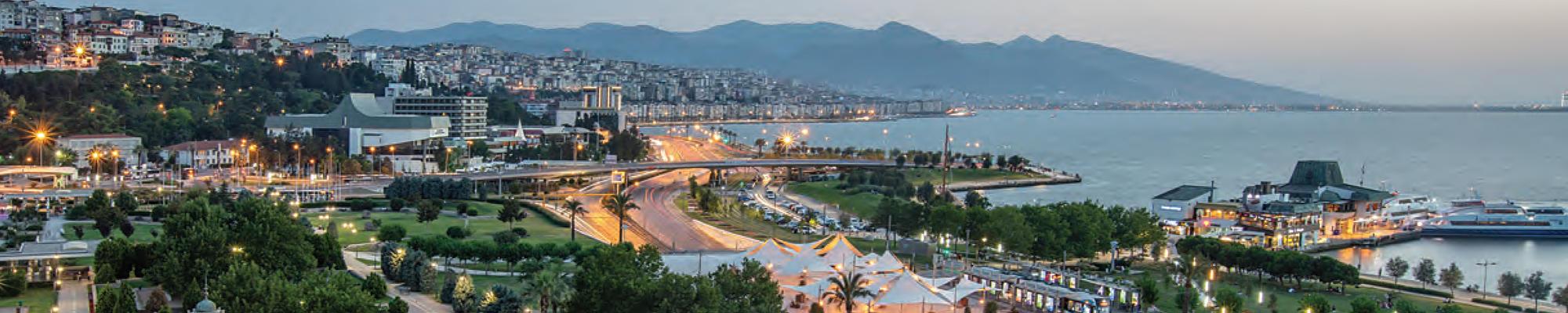 A photo from above of the İzmir waterfront. Mountains are visible in the background