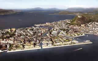 The picture is a visualistion from above of how the Sørsida area might look in the future. It show the city of Ålesund and what appears to be a seriies of new buildings on the waterfront area.