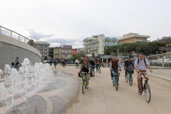 A small group of people biking. 